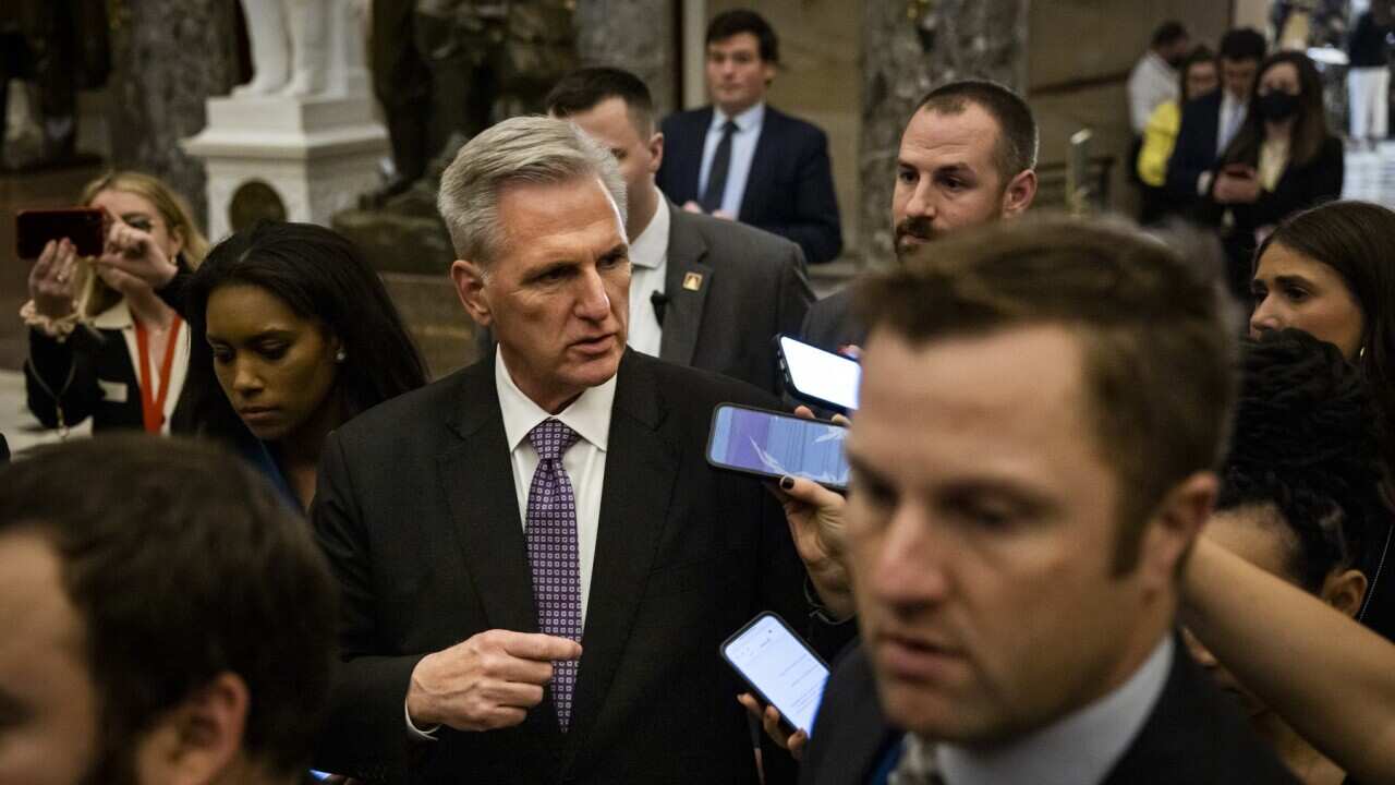 House Majority Leader Kevin McCarthy is surrounded by reporters as the House of Representatives adjourns