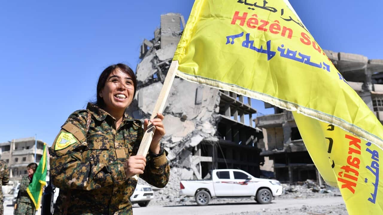 SDF commander Rojda Felat celebrates in Raqqa