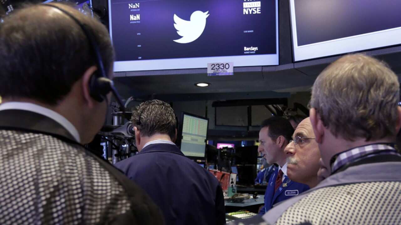 Traders near the Twitter post at the New York Stock Exchange