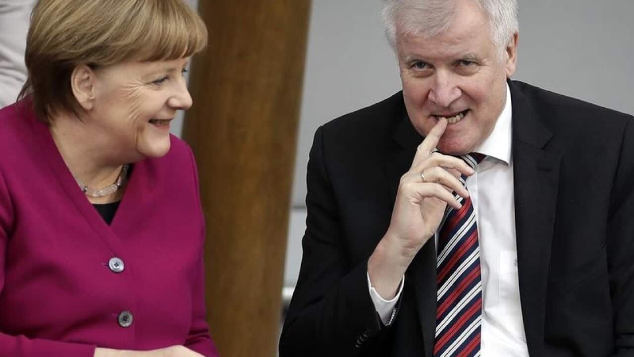 German Interior Minister Hoorst Seehofer and Chancellor Angela Merkel