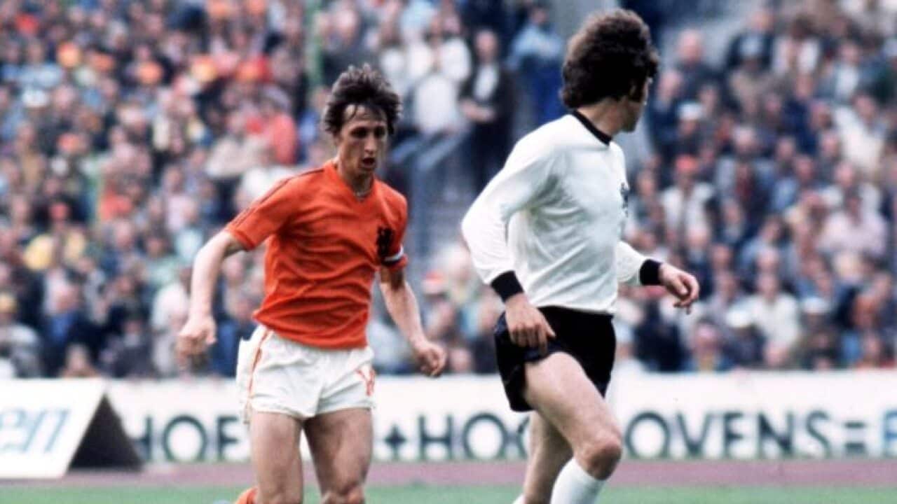 Holland's Johan Cruyff runs at West Germany's Franz Beckenbauer in the 1974 World Cup final