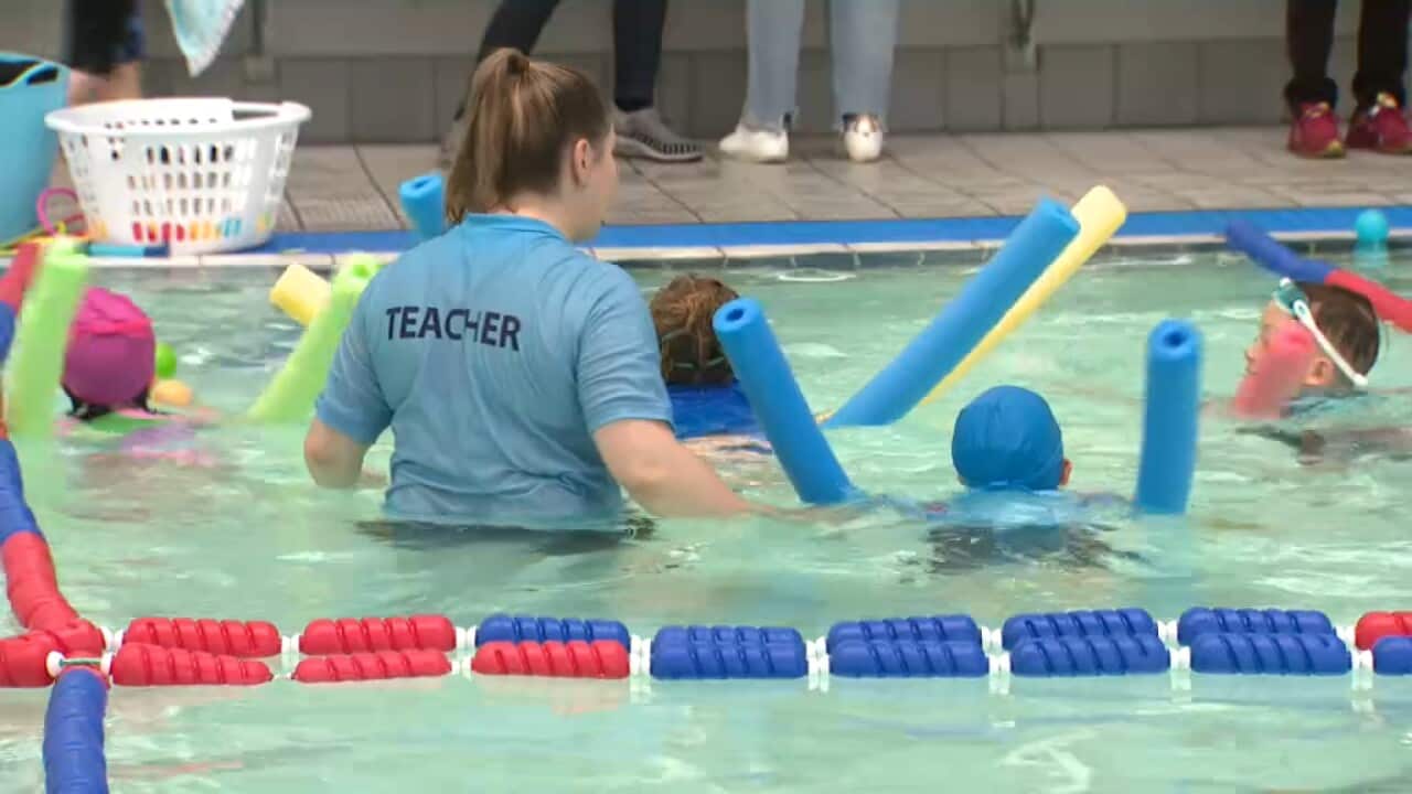 Swimming teacher and children at a Melbourne pool November 20 2023 SBS.jpg