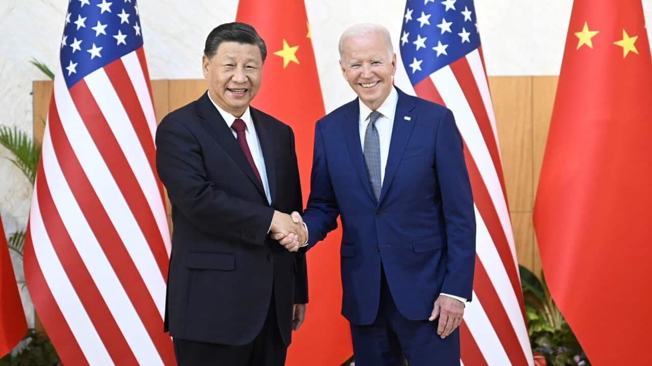 Chinese President Xi Jinping greets his US counterpart Joe Biden before their meeting