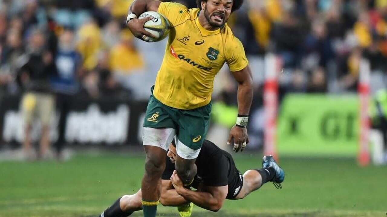 Henry Speight of Australia is tackled by Lima Sopoaga.