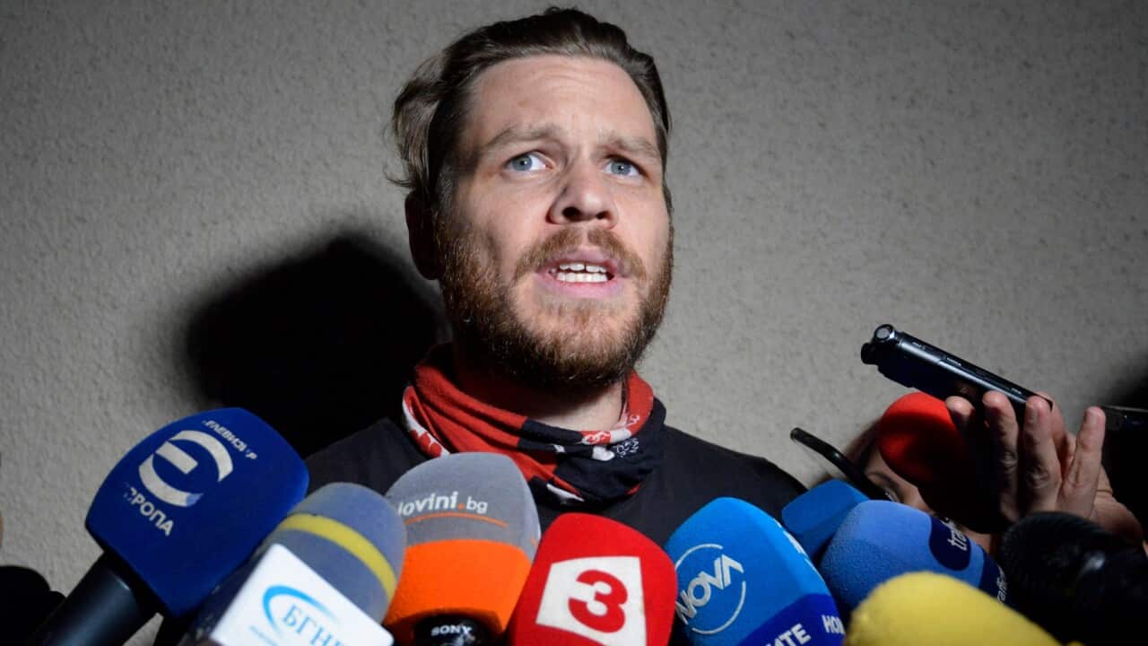 Jock Palfreeman speaks to journalists as he leaves migrants' detention centre in Busmantsi, Bulgaria