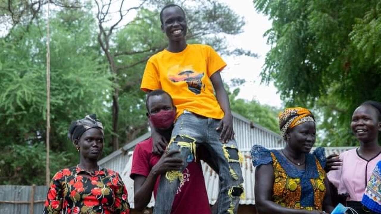 Reec Kuol Mayen with the family members