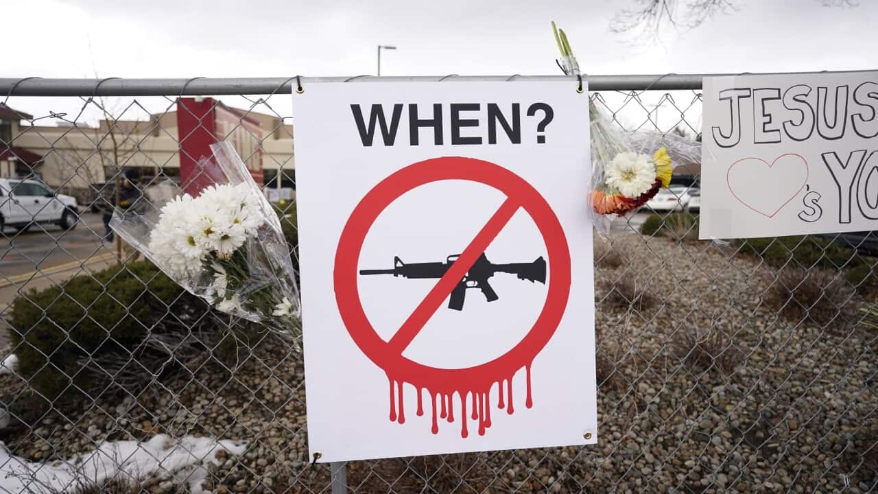 A sign at the scene of the mass shooting in Boulder, Colorado