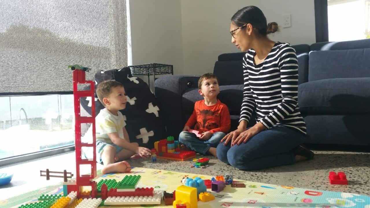Deb Kozaris plays with her twin boys Isaac and Christian
