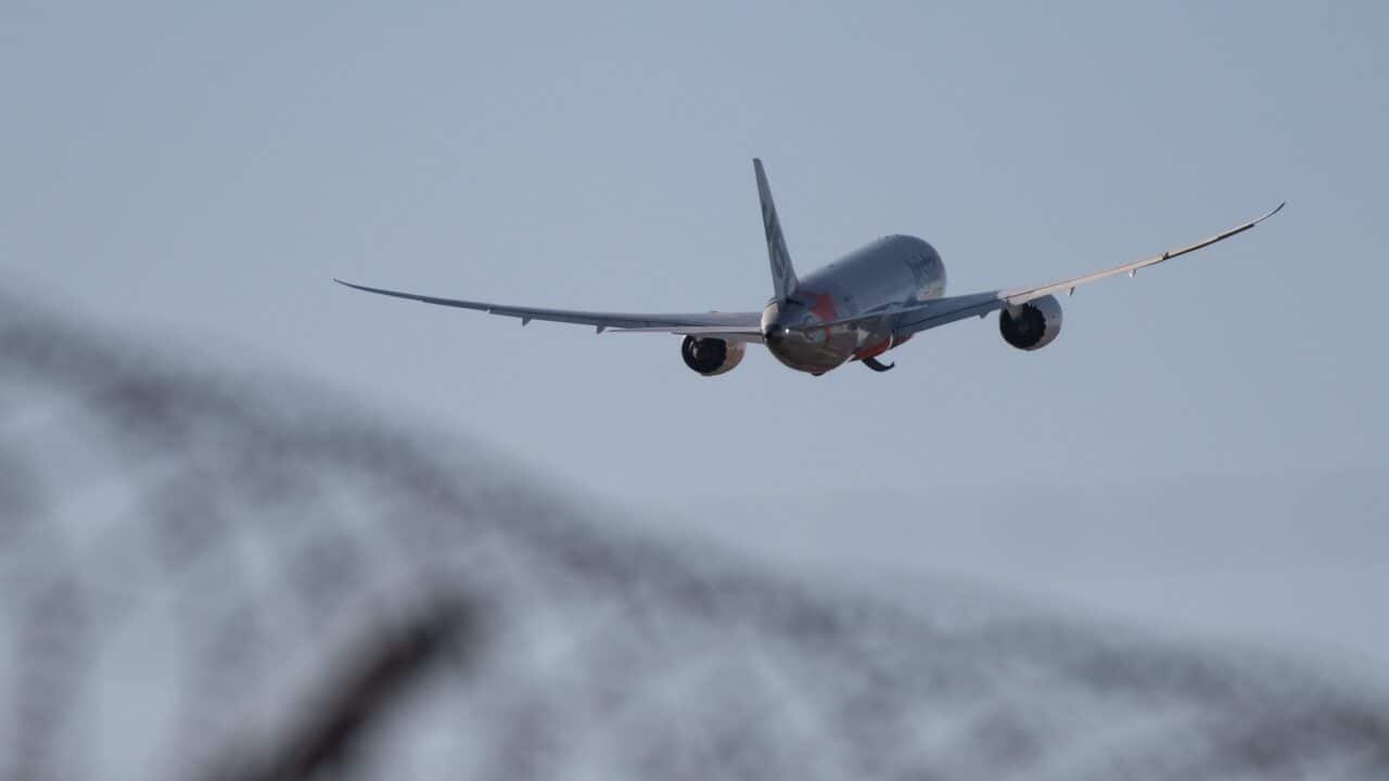 An aircraft taking off from Sydney Airport, Friday, March 20, 2020.
