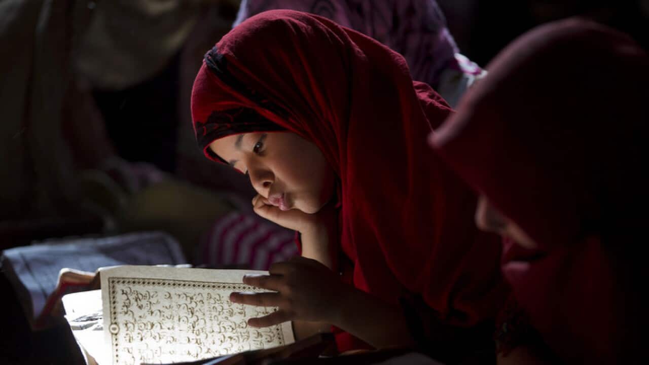 Pakistani girls study the Quran at a local madrassa, or religious school, in Islamabad, Pakistan, Thursday, May 8, 2014. (AP Photo/B.K. Bangash)