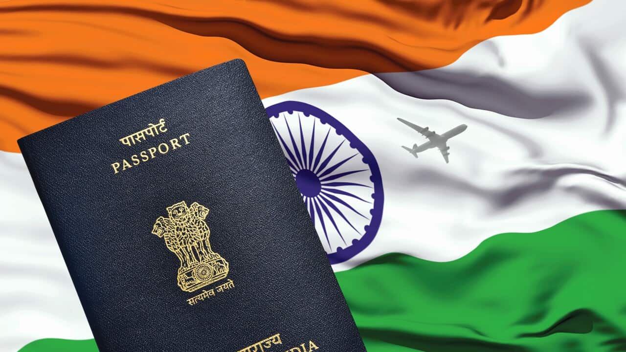 Indian passport lying on Indian flag