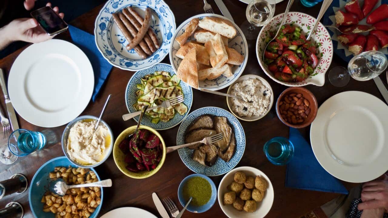 A kitchen table filled with different mezze