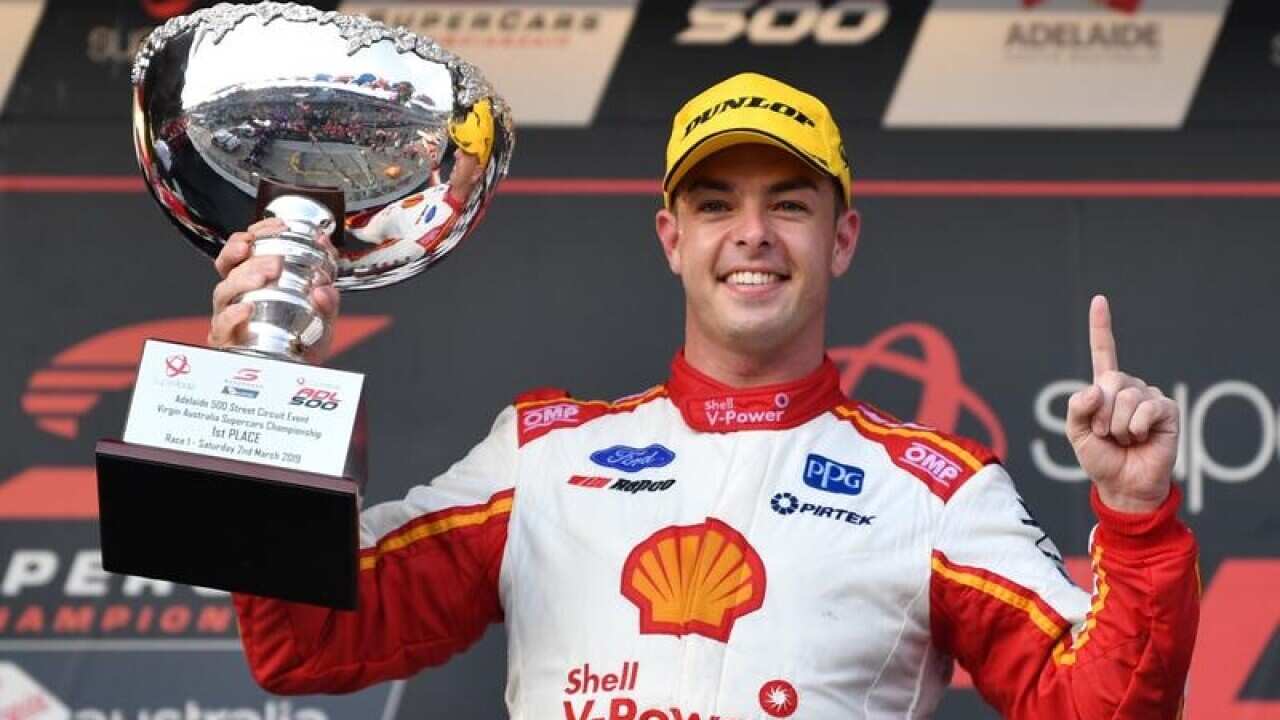 Scott McLaughlin hold the winning trophy.