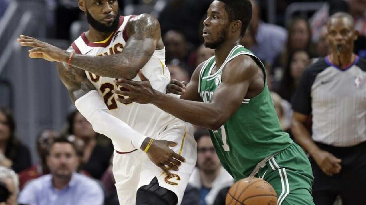 Cleveland Cavaliers' LeBron James passes against Boston Celtics.