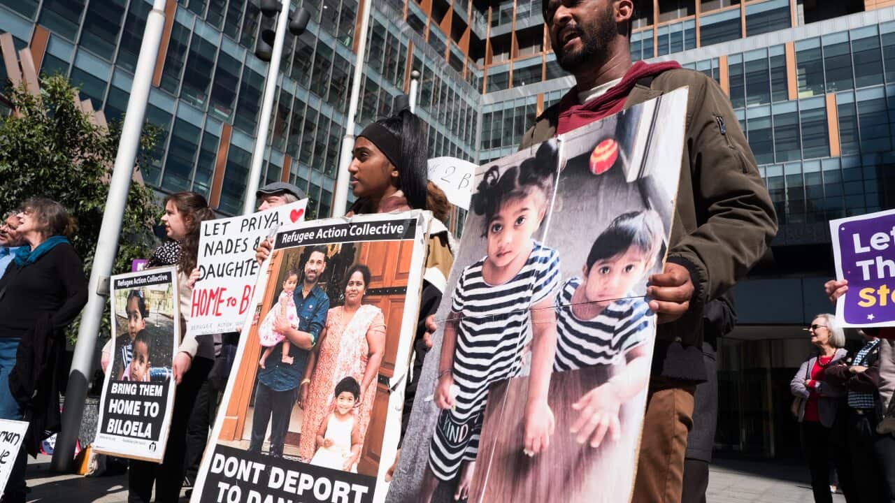 Protestors support the Tamil Biloela family in 2019. Refugee advocates are urging DFAT to retract a report they say is used to undermine Tamil protection claims