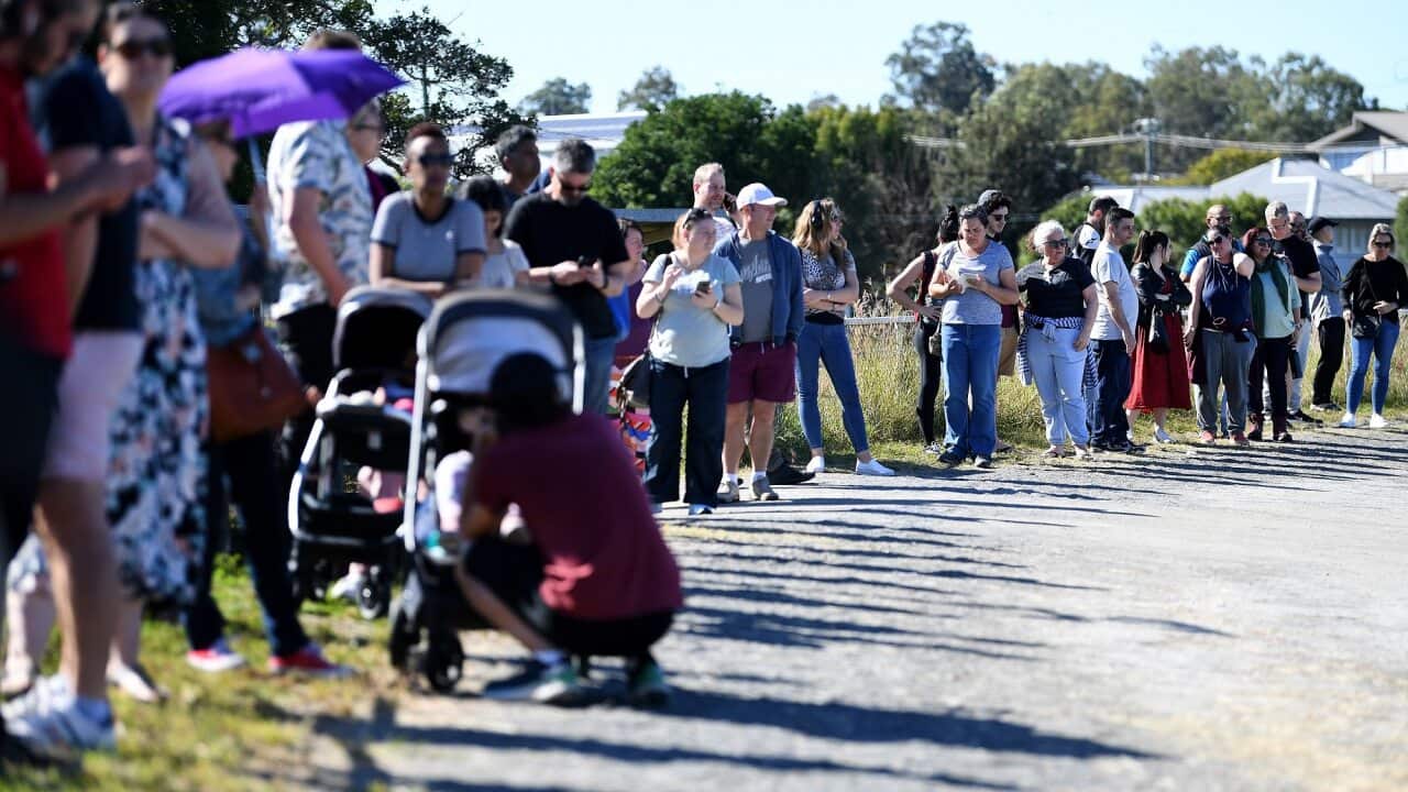 People line up to receive a coronavirus vaccination at the Rocklea Showgrounds in Brisbane on 5 June 2021.