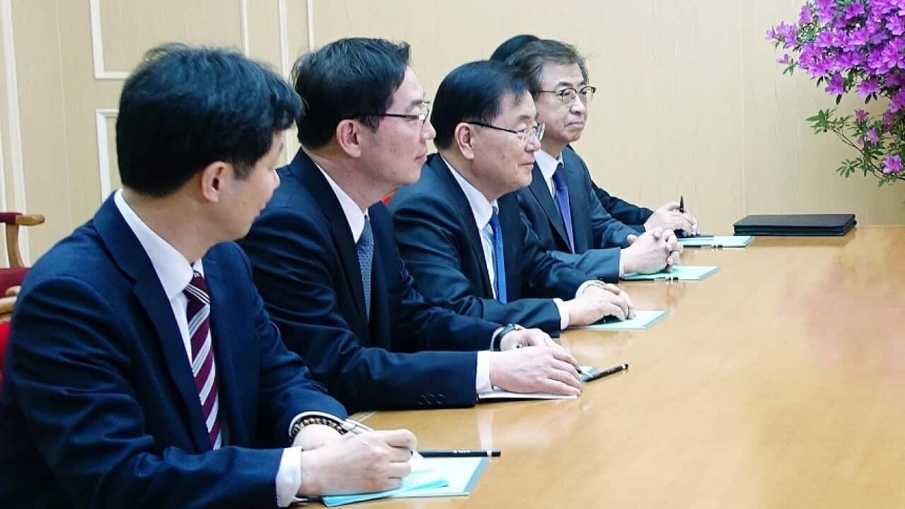 South Korea's Chung Eui-yong (third left) talks to Kim Yong-chol (second right), vice chairman of the Central Committee of North Korea's ruling Workers' Party.