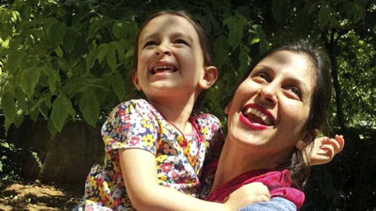 In this undated photo provided by the Free Nazanin Campaign, Nazanin Zaghari-Ratcliffe hugs her daughter Gabriella in Iran.