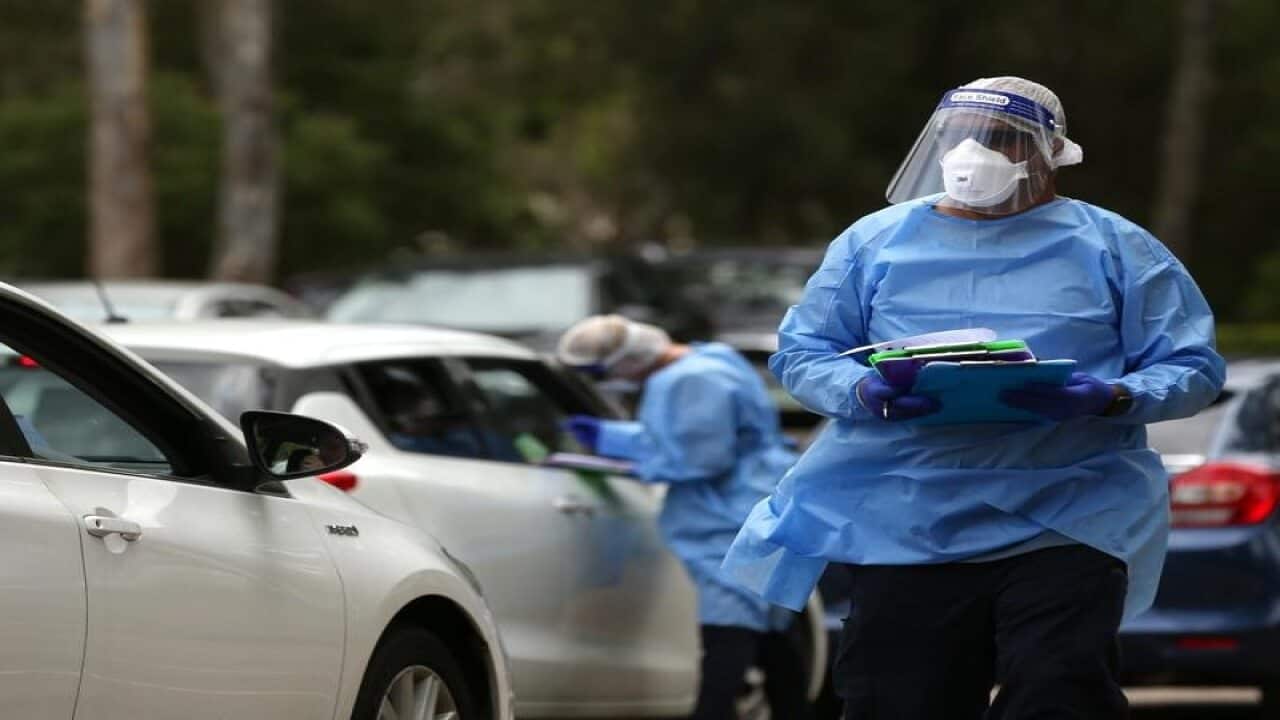 Members of the public queue for a Covid19 PCR test