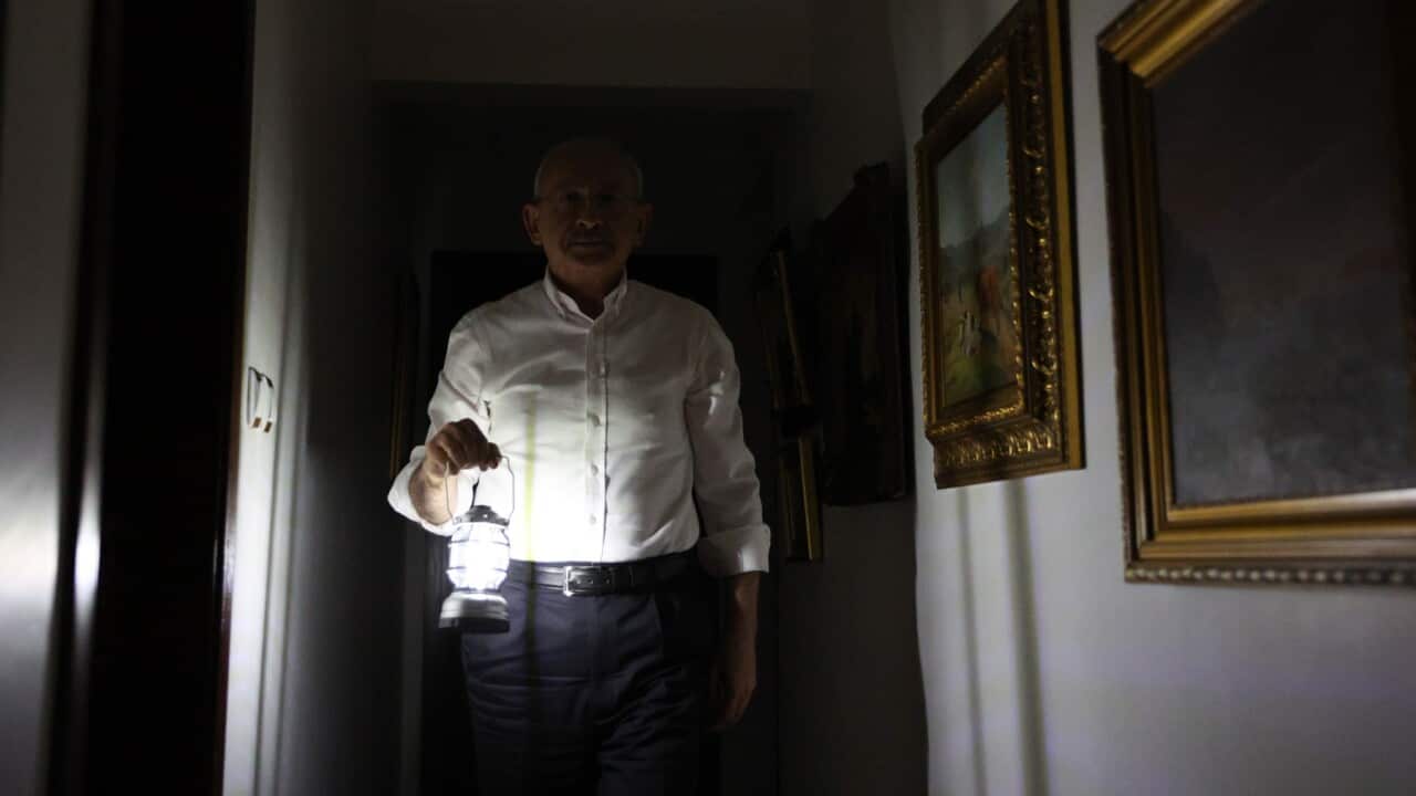 Handout photos made available by the Republican People's Party (CHP) press office shows, main opposition Republican People's Party (CHP) leader Kemal Kilicdaroglu works with a hand lamp at his apartment,