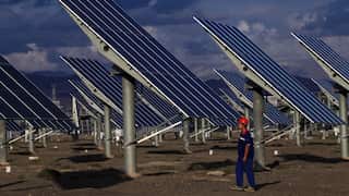 Photovoltaic panels are neatly arranged on the Gobi Desert in Hami, Xinjiang, China.