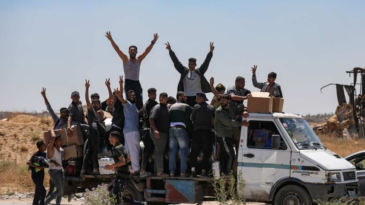 Palestinians receive aid from US-backed group at Gaza's Netzarim Corridor