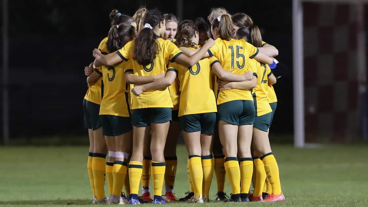 The Young Matildas huddle before a match