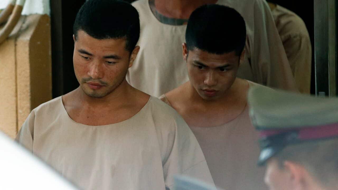 Zaw Lin (L) and Wai Phyo (R) are escorted by Thai police officers after they were sentenced to death in 2014.