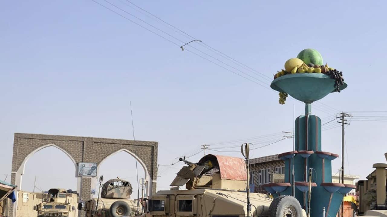 Afghan security personnel petrol in the city of Ghazni.