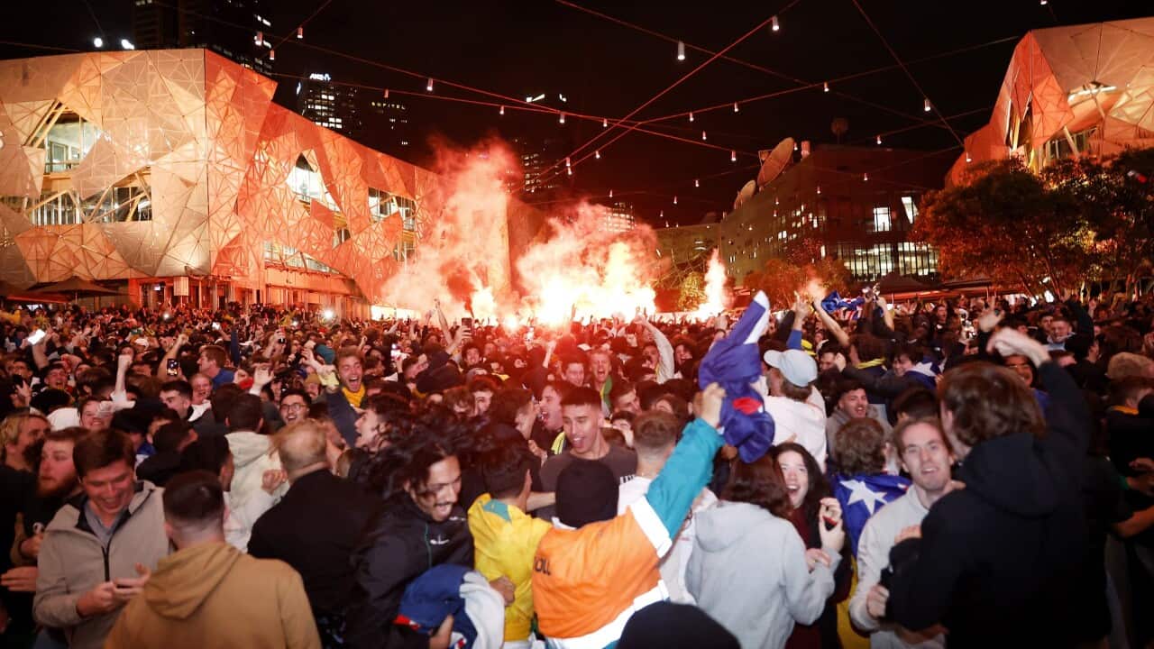Socceroos fans cheering about a goal scored by Australia in the FIFA World Cup, at Melbourne's Federation Square in Melbourne.