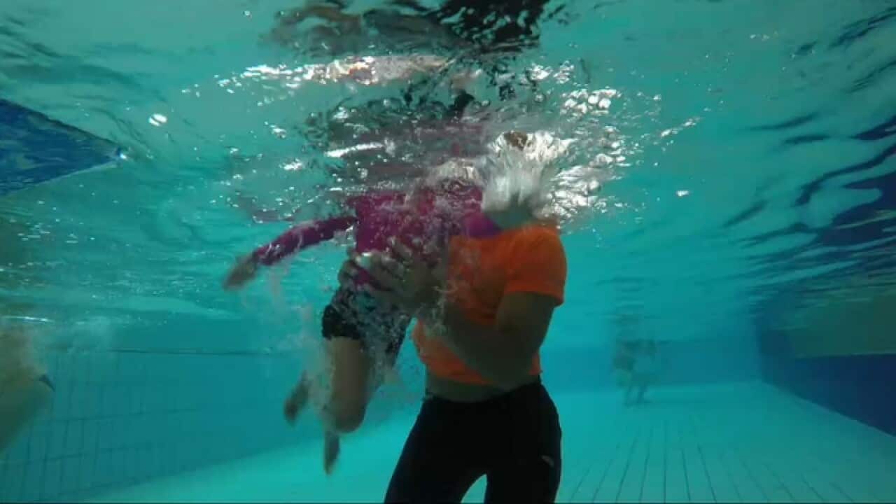 A child learning to swim