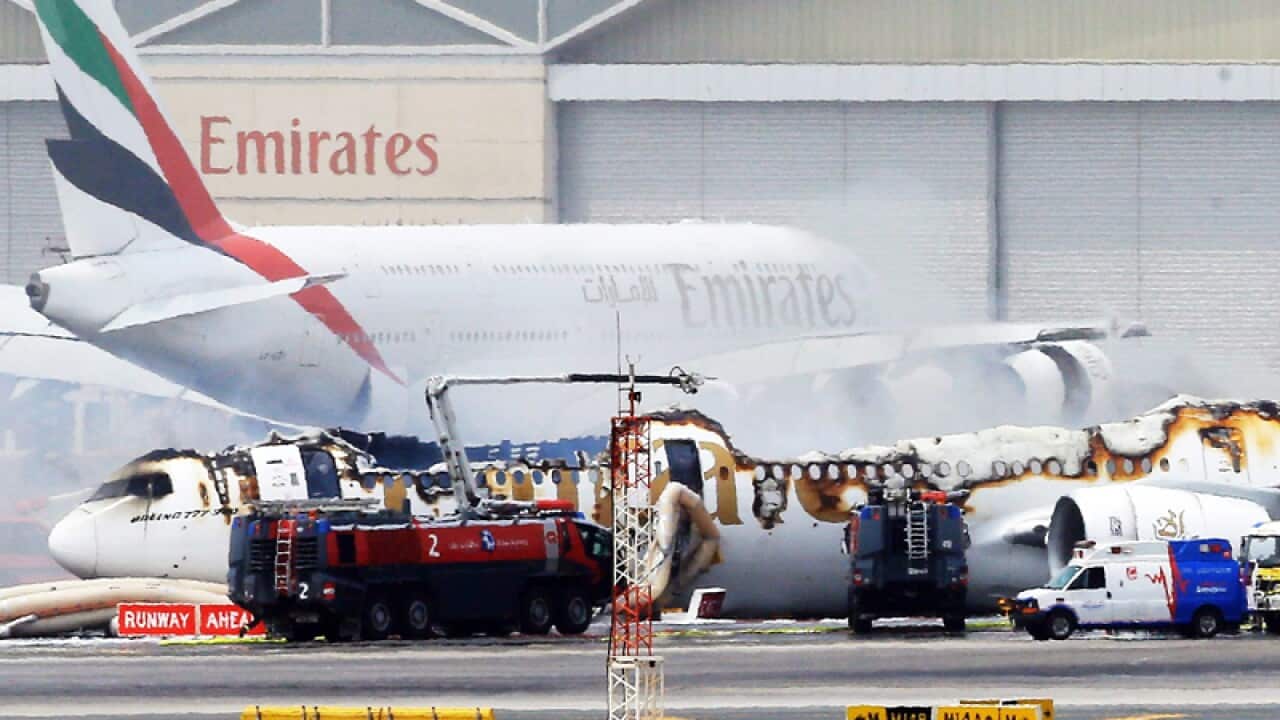 An Emirates plane after being gutted by fire at Dubai airport