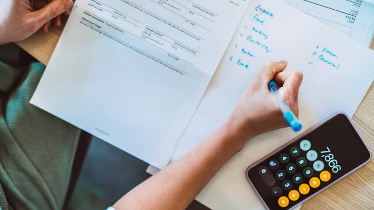 A person calculating their budget