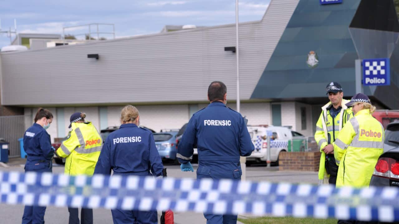 Police and forensic officers investigate the scene of a fatal shooting of an 18-year-old Narre Warren man at Endeavour Hills Police Station (AAP Image/Julian Smith) 