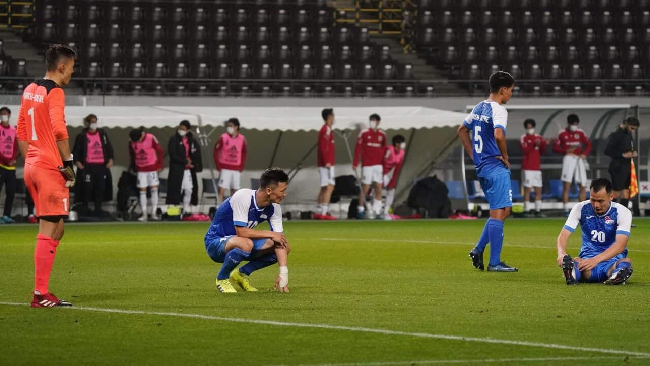 Mongolia players look dejected after a 14-0 loss to Japan