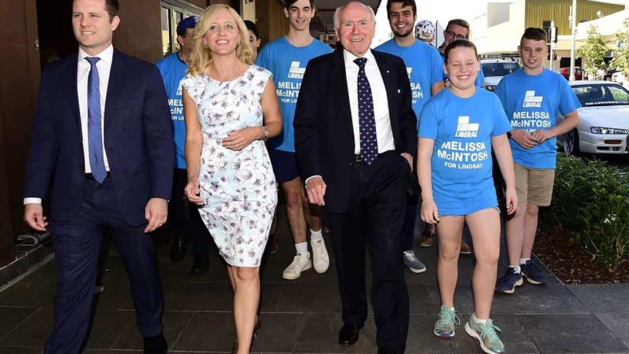 Liberals candidate Melissa McIntosh with John Howard and supporters.