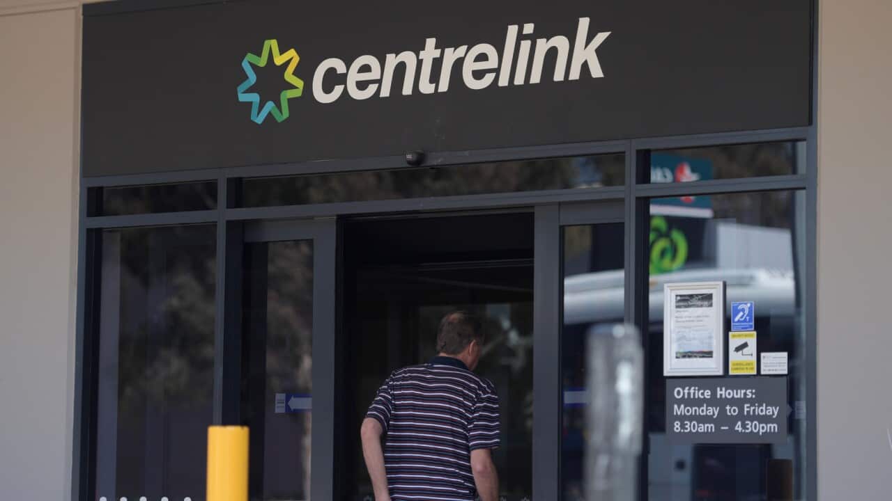 A man walking into a Centrelink office