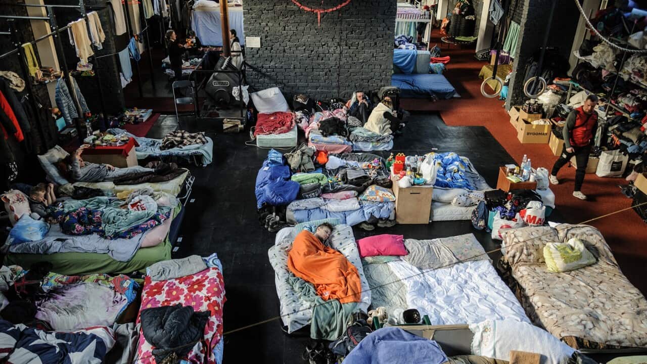 People at a gym converted for accommodation for refugees from the Russian military aggression in Ukraine