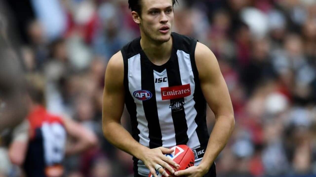 A file image of Darcy Moore of the Magpies before he punts the ball.