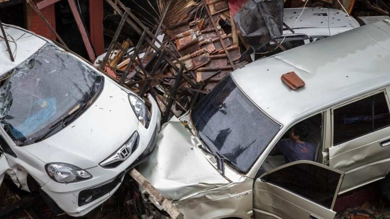 smashed cars in Indonesia