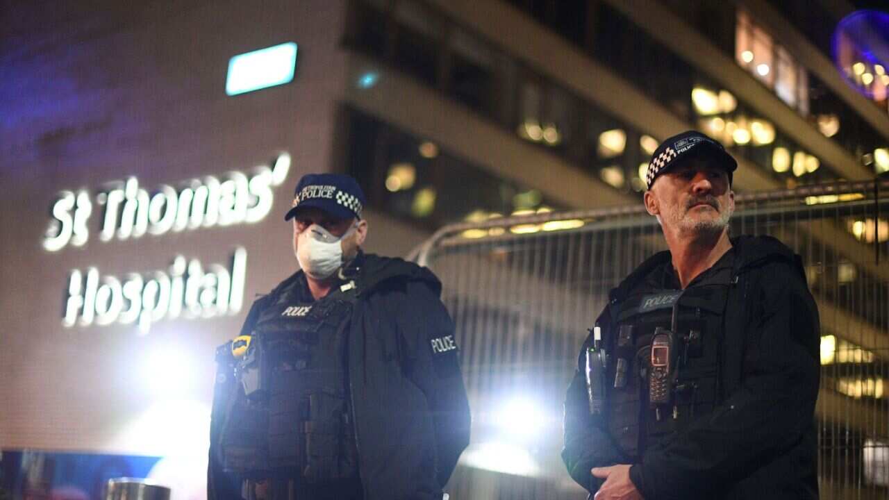 Police officers outside St Thomas' Hospital where British PM Boris Johnson is in intensive care