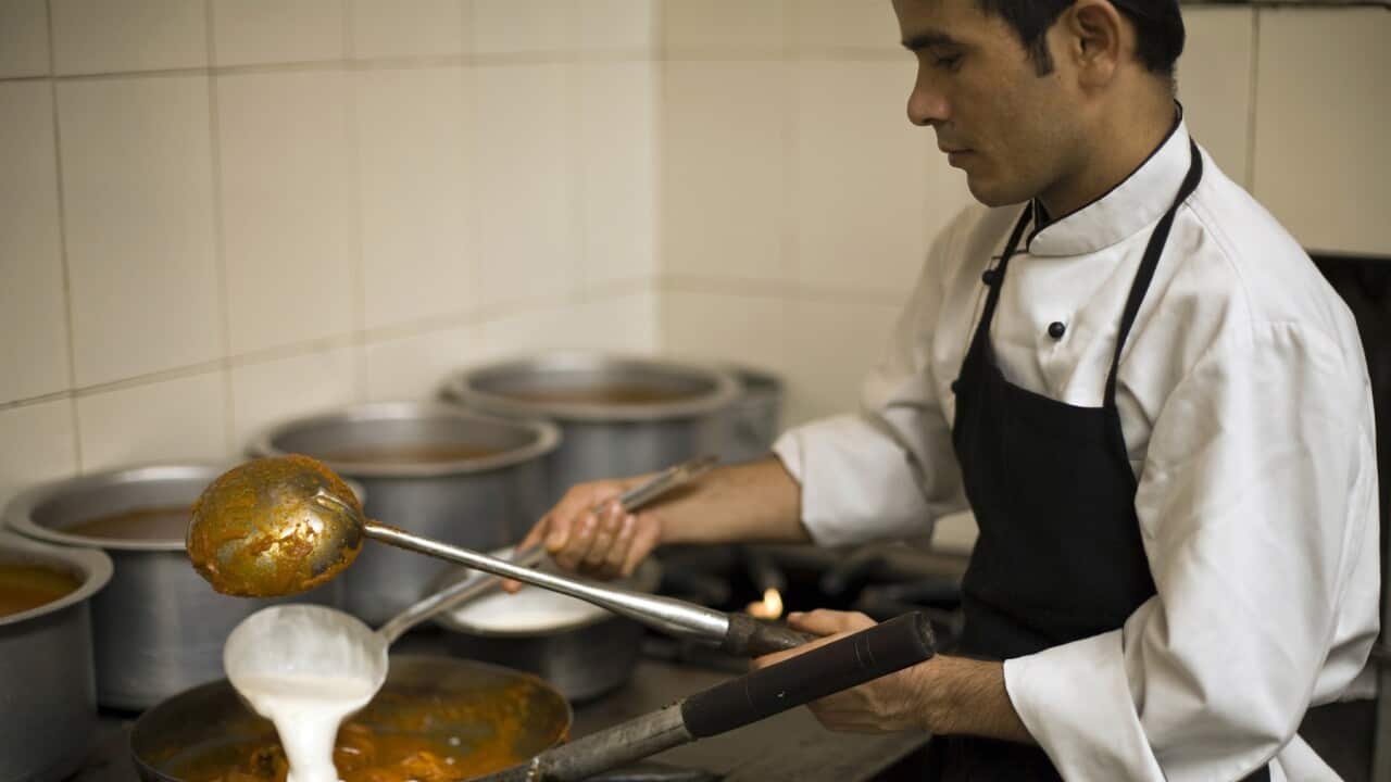 A chef prepares a dish of butter chicken at Moti Mahal Restaurant in Old Delhi, India (Getty)