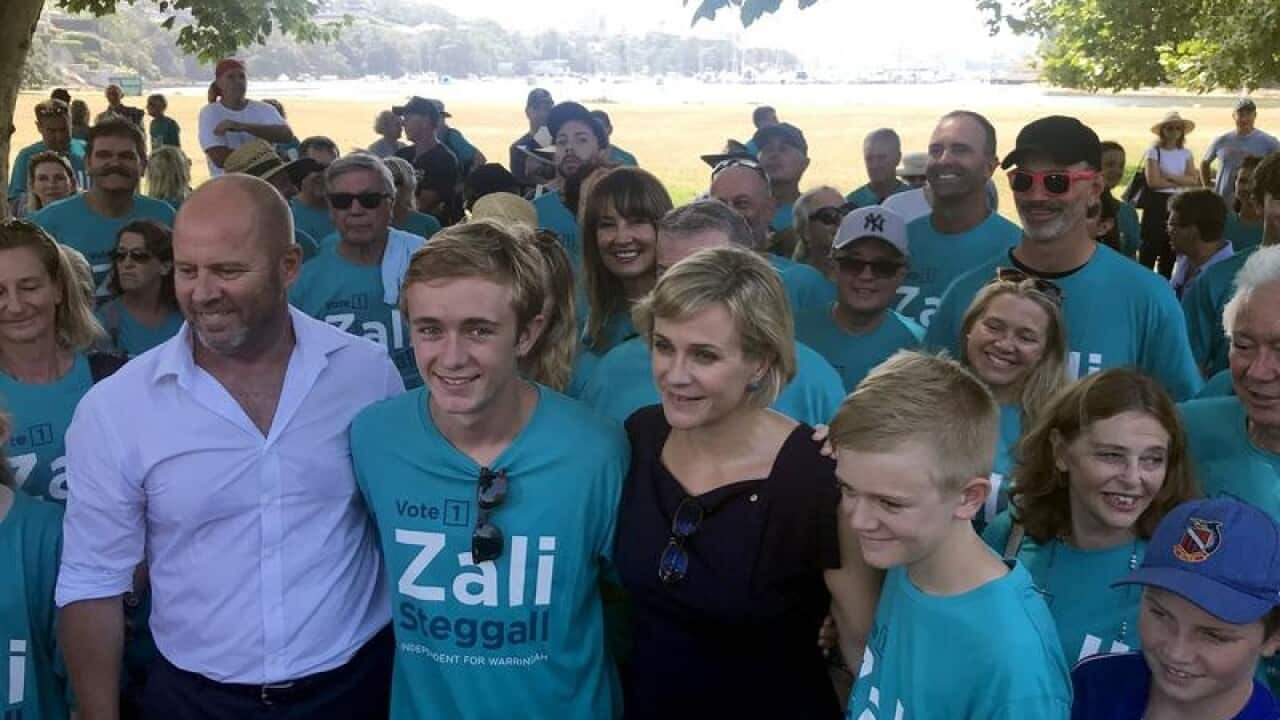 Waringah candidate Zali Steggall poses with supporters.