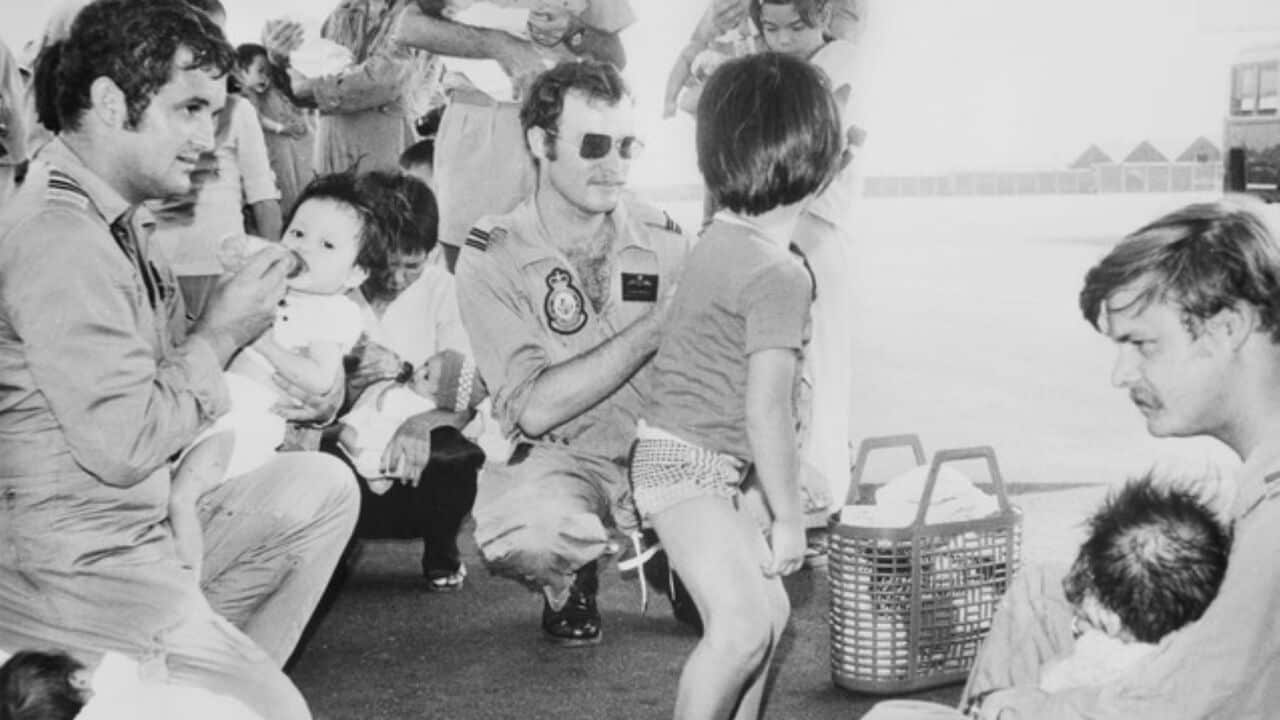 Image of RAAF officers caring for children ahead of Operation Babylift flight (Image supplied - RAAF).jpg