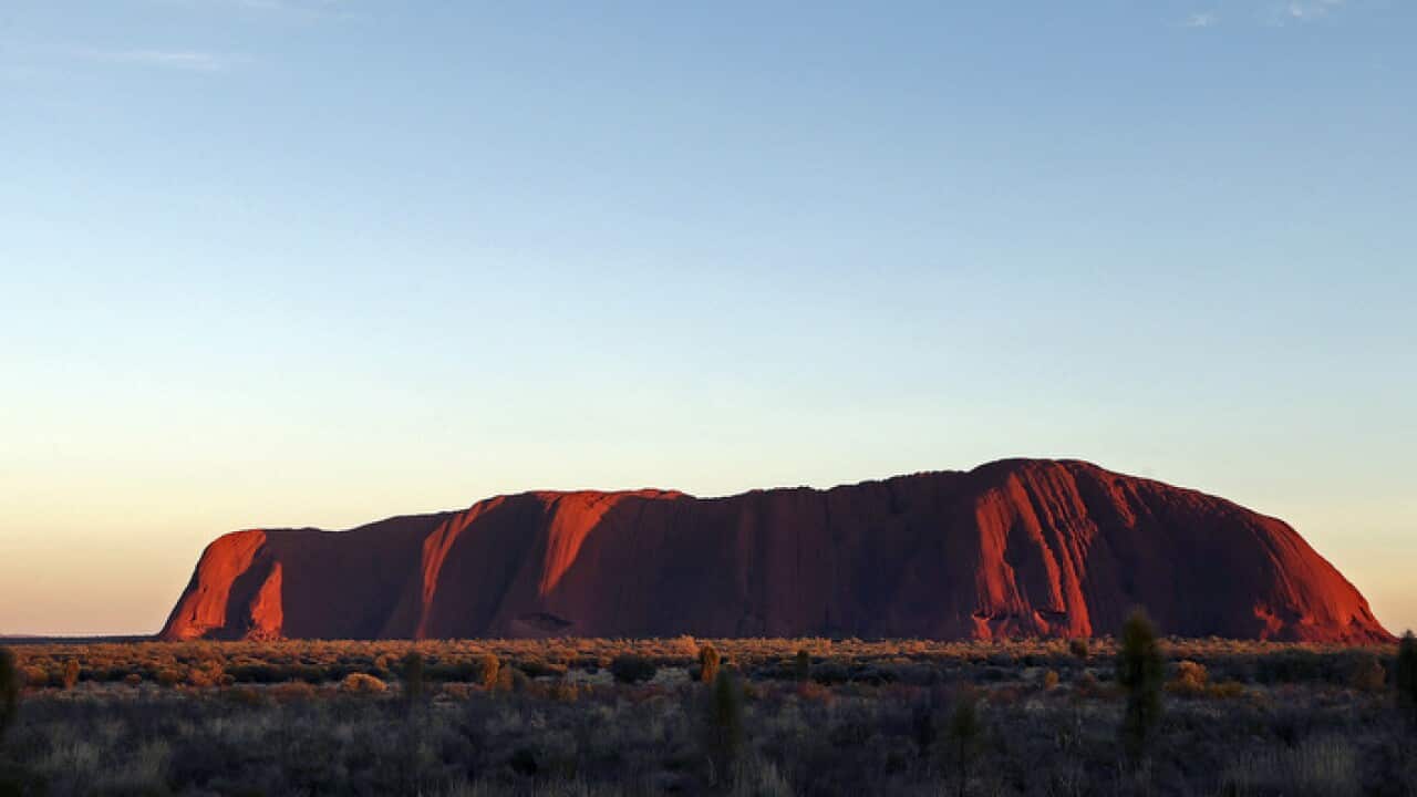 Sun rises over Uluru