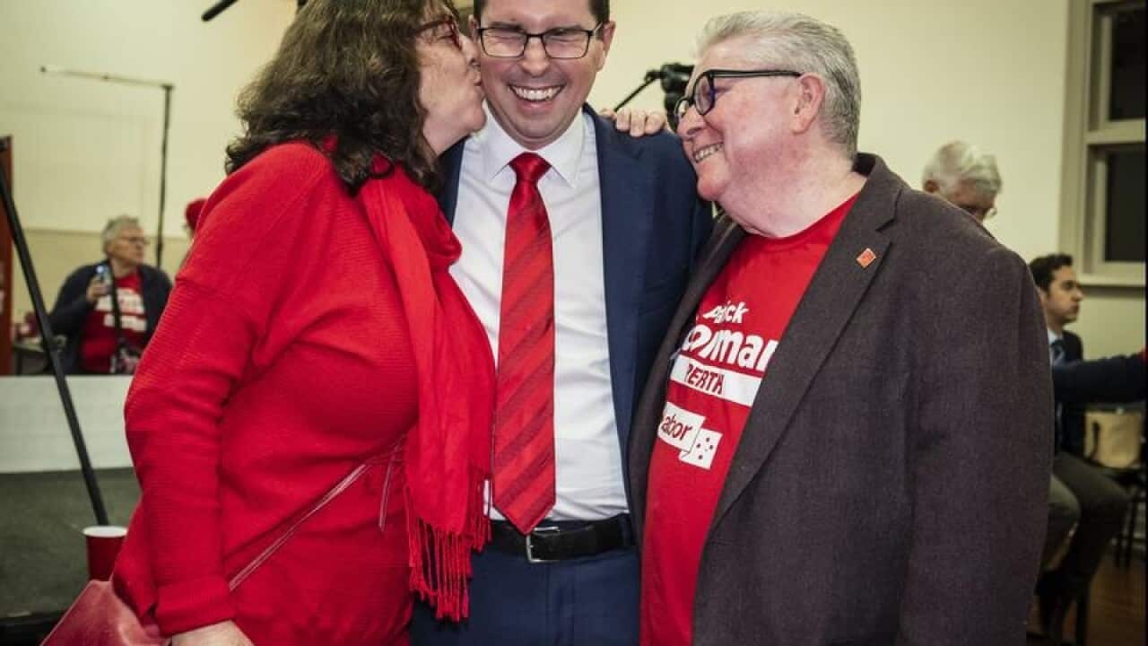 Labor candidate Patrick Gorman hugs his parents Wendy and ROn.