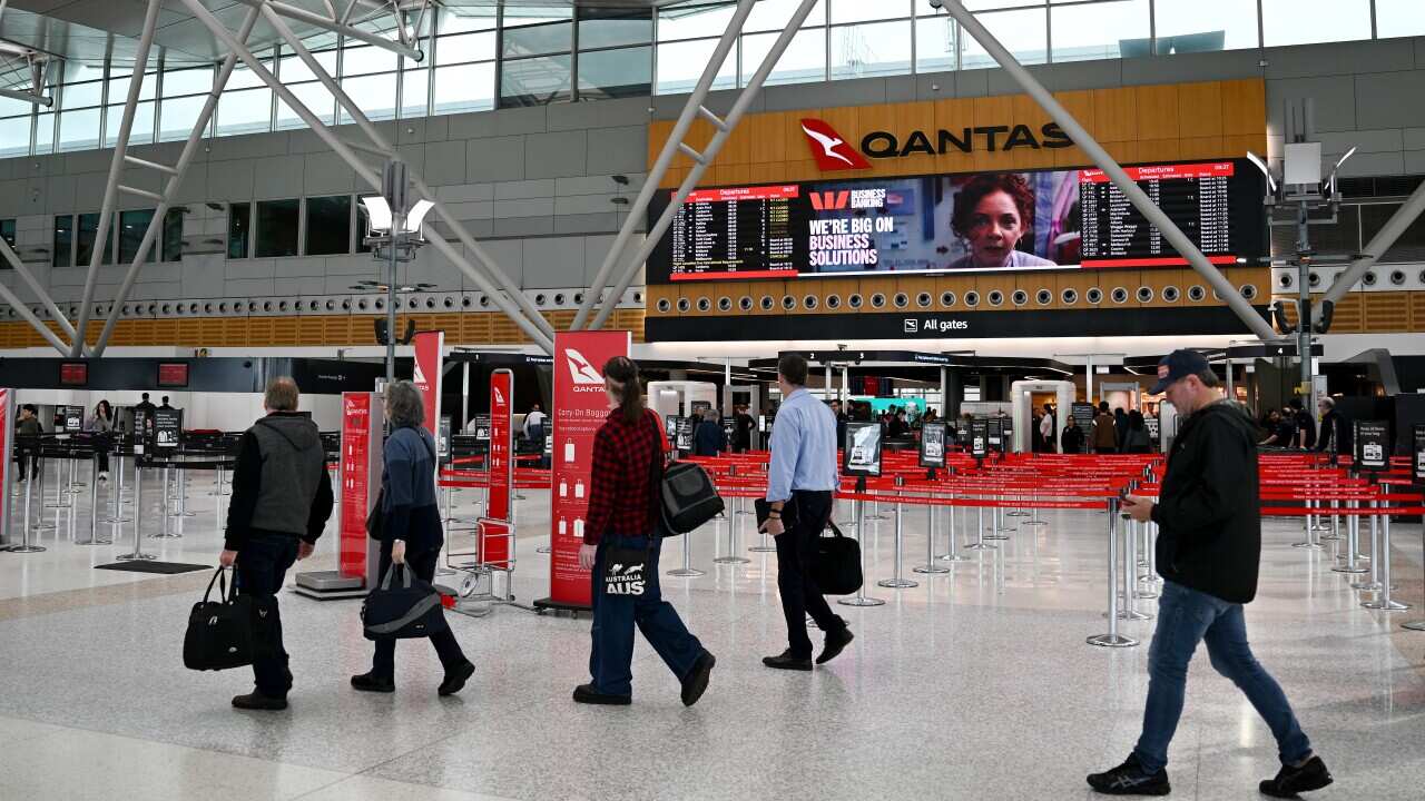 People walking at an airport.