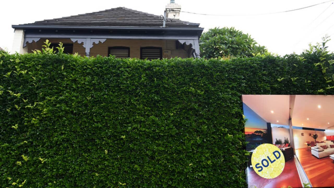 A for sale sign is displayed in front of a house in Sydney on Wednesday, April 26, 2017. (AAP Image/Paul Miller) NO ARCHIVING
