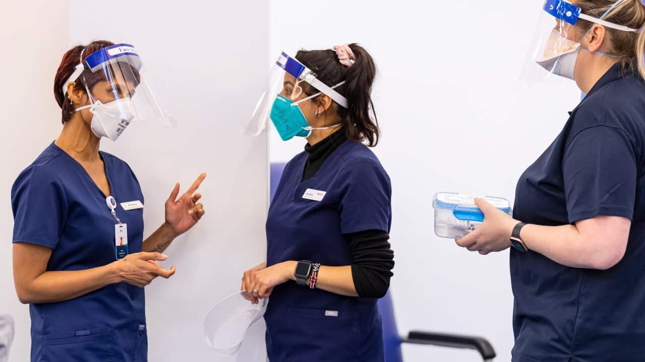 Health care workers at a COVID vaccination hub at the Heidelberg Repatriation Hospital in Melbourne.