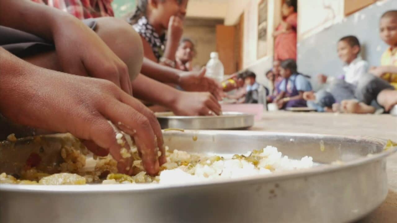 The Akshaya Patra program provides school lunches for children. (SBS)